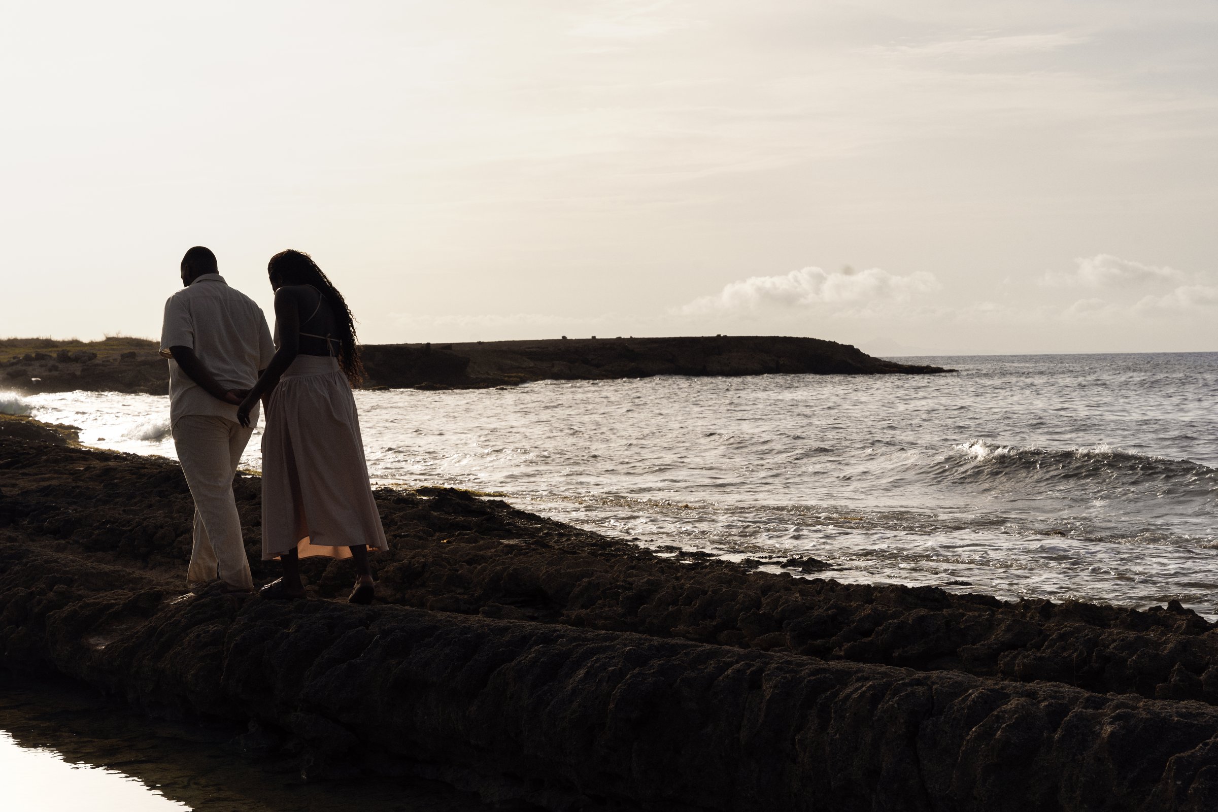 Chris and Shay watching the sunset by the ocean